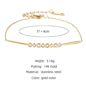 Detail view of gold-plated stainless steel bracelet showing 17cm length and zircon charms