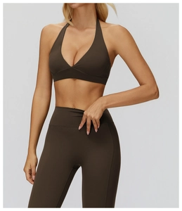 Detail of high-elasticity dark brown halter sports bra and high-waist yoga leggings
