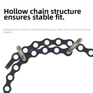 Detail of black flexible watch strap with chain-hole structure and silver metal buckles
