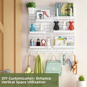 Modular white pegboard wall organizer set with hooks and trays for home storage