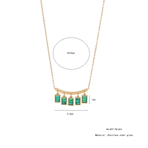 Detail of gold stainless steel necklace featuring five green rectangular glass pendants
