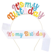 Detail of glittery It's my Birthday headband and white satin sash party accessories