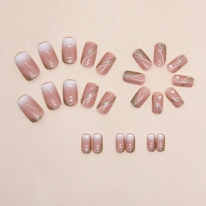Pink gradient press-on nails with glitter French tips and white heart designs