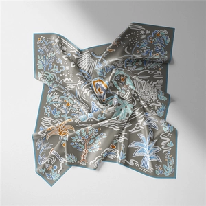 Detailed pattern of a floral silk scarf with hand-painted botanical prints on taupe fabric