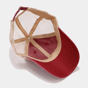 Detailed interior view of a red and beige washed vintage mesh breathable baseball cap