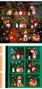 Detailed view of colorful Christmas gnome static stickers on glass windows and doors