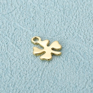 Polished golden four-leaf clover pendant necklace charm made of stainless steel