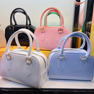 Boston jelly handbag set featuring glossy black, pink, white, and blue PVC colors