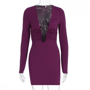 Detail of the deep V-neckline and ruched waist on this slim fit purple mini dress