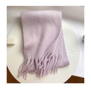 Detail of lavender brushed plush scarf with fringe on a minimalist background