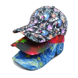 Three assorted baseball caps featuring palm leaf, starry sky, and vintage art prints