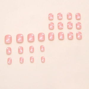 Faux ongles courts et ronds roses avec motifs de fleurs blanches lot de 20