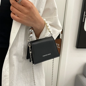 Elegant black PU leather flap handbag with pearl handle and silver chain strap for women