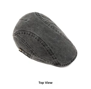 Detail view of washed dark gray flat cap showing vintage texture and side buckle