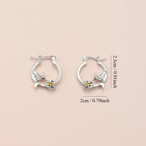 Silver hummingbird and flower earrings with size dimensions 2.3cm by 2cm and yellow gems