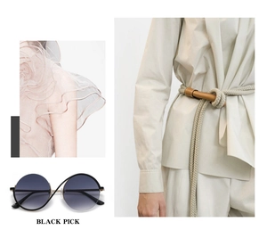 Detailed view of oversized round metal sunglasses with black gradient lenses for fashion