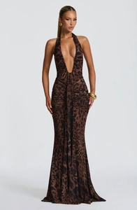 Detail of leopard print maxi dress featuring halter deep V-neck and ruched waist design