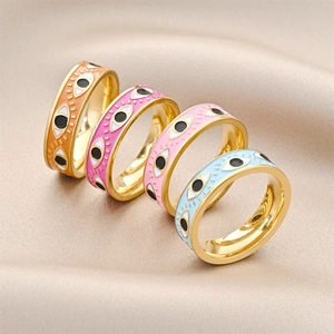 Set of four gold stainless steel evil eye rings with colorful enamel finishes