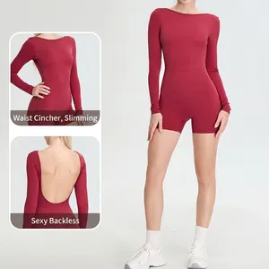 Deep red long sleeve yoga bodysuit with slim fit and open back design for fitness
