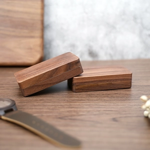 Close-up of black walnut wood jewelry box with natural grain and elegant lid design