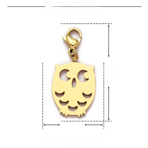 Detailed view of a golden stainless steel owl charm with 30mm height and lobster clasp