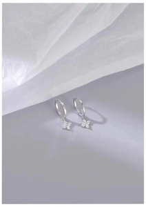 Detailed macro view showing the S925 hallmark on silver flower drop earrings with zircon