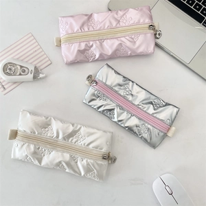 Quilted bow pattern PU stationery pouches in pink, silver and cream with floral zippers