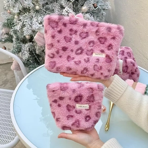 Pink plush faux fur makeup bags with heart leopard patterns and zip closure