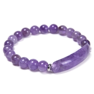 Detail view of natural purple amethyst bracelet with smooth round beads and focal stone