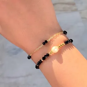 Bohemian stackable bracelet set with black crystals and pearl on gold-plated chain
