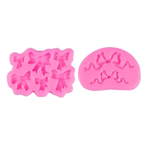 Pink silicone crown and bow molds for DIY fondant, clay, and resin cake decorations