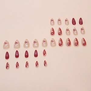 Kit 24 faux ongles amande bordeaux et rose nude avec motifs floraux et rayures