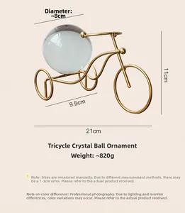 Detail shot of tricycle crystal ball decor with dimensions: 21cm length and 8cm ball diameter