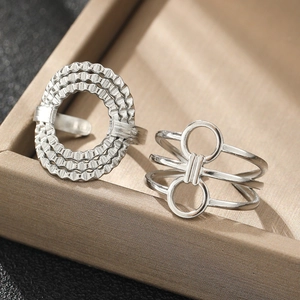 Irregular geometric stainless steel open rings set in silver with textured finish