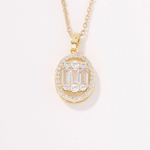 Elegant gold oval halo necklace featuring rectangular and round clear crystals