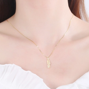 Elegant S925 silver gold plated necklace featuring a bamboo pendant with cat eye stone