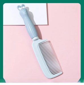 Detail of cute rabbit handle hair comb in Nordic Blue color, fine-tooth plastic brush.