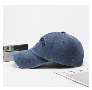 Detail view of the vintage washed blue cotton cap featuring 3D PLUS embroidery