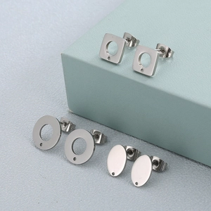 Three pairs of geometric hollow and solid silver stainless steel stud earrings set