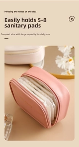 Internal view of pink waterproof PU pouch holding multiple sanitary pads with zipper detail