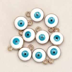 Detailed close-up of 8mm blue evil eye pendants with gold plating for DIY jewelry making