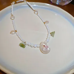 Stainless steel pearl necklace with green lily of the valley and seashell pendant