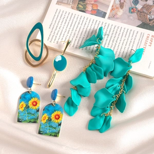 Detail of 6-piece acrylic drop oil earrings with green geometric and sunflower patterns