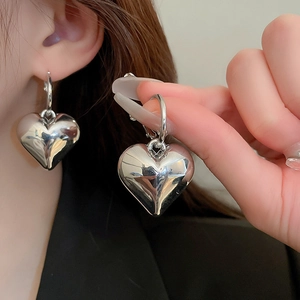 Chic metallic heart pendant hoop earrings with a high-polished silver finish for women