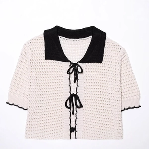 Minimalist beige crochet knit polo cardigan with black collar and bow ties for women