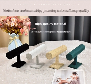 Detail of four T-bar jewelry display stands in velvet and linen with weighted bases