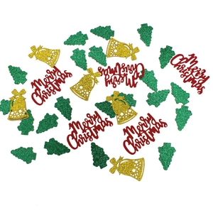 Christmas table confetti with green trees, red Merry Christmas text and gold bells