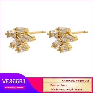 Detail view of gold-plated geometric brass studs with rectangular clear zircon stones