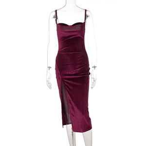 Detail of burgundy velvet dress featuring side slit and pleated neckline texture