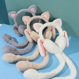 Three plush cat-ear earmuffs in grey, khaki, and white with glittery sequins details